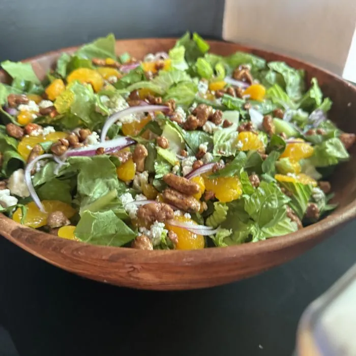 A big salad in a wooden bowl