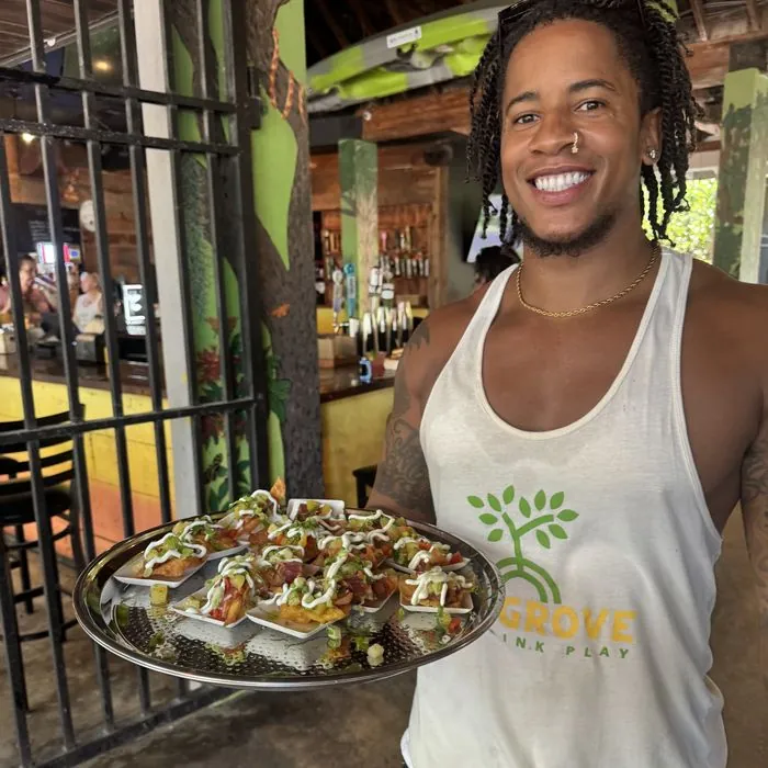 Our server with a tray of bites